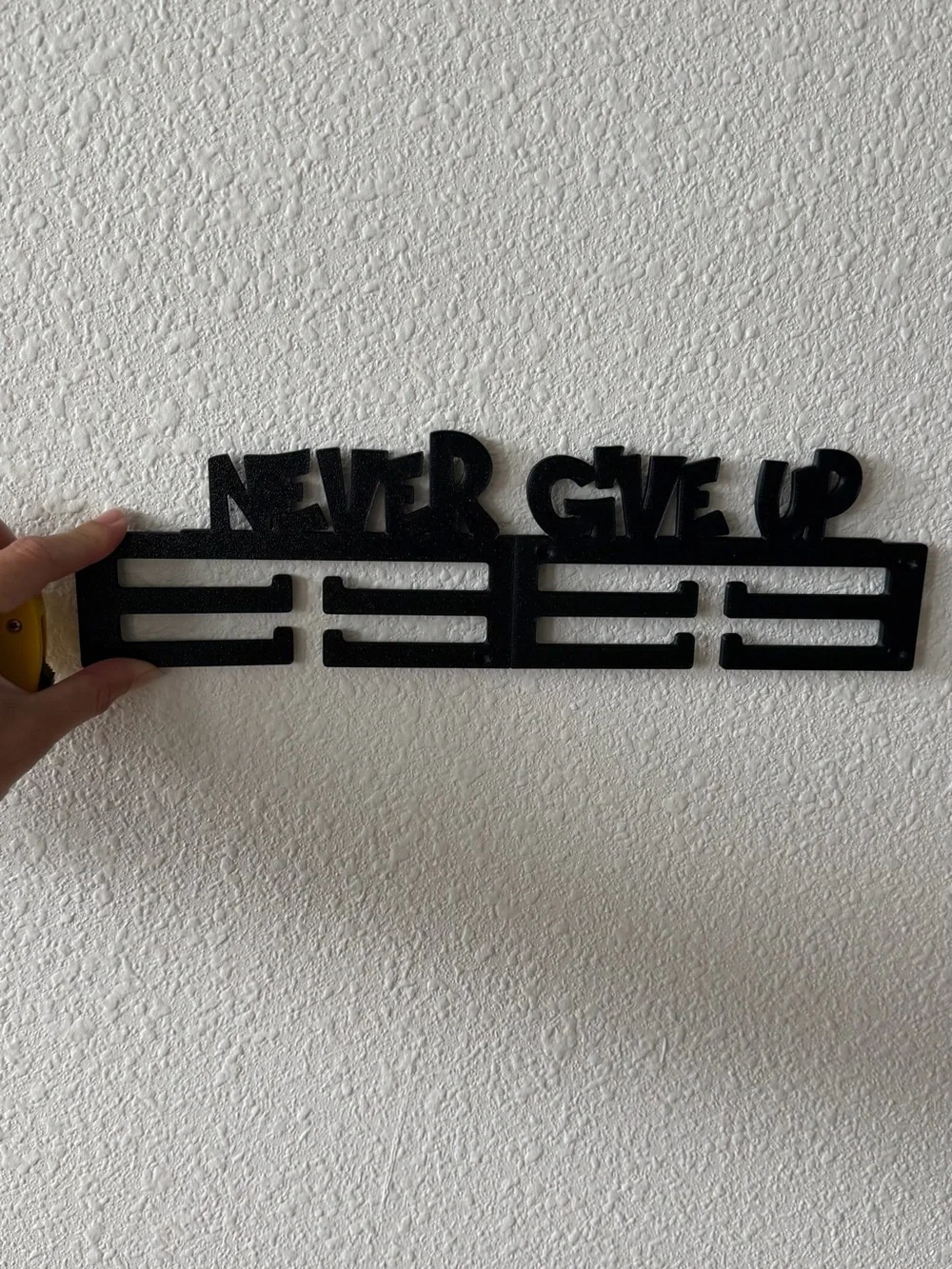 Never Give Up Black Metal Medal Hanger - Inspirational Wall Hook